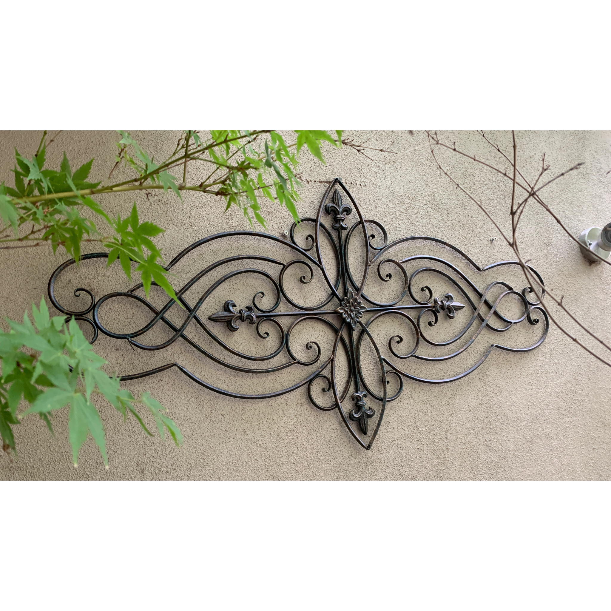 Wall Art, Abstract Metal Decorative - Antique Brown  in the garden on a wall 