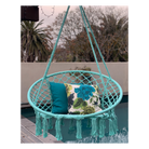 Macrame Hanging chair. Made from woven spearmint coloured cotton,