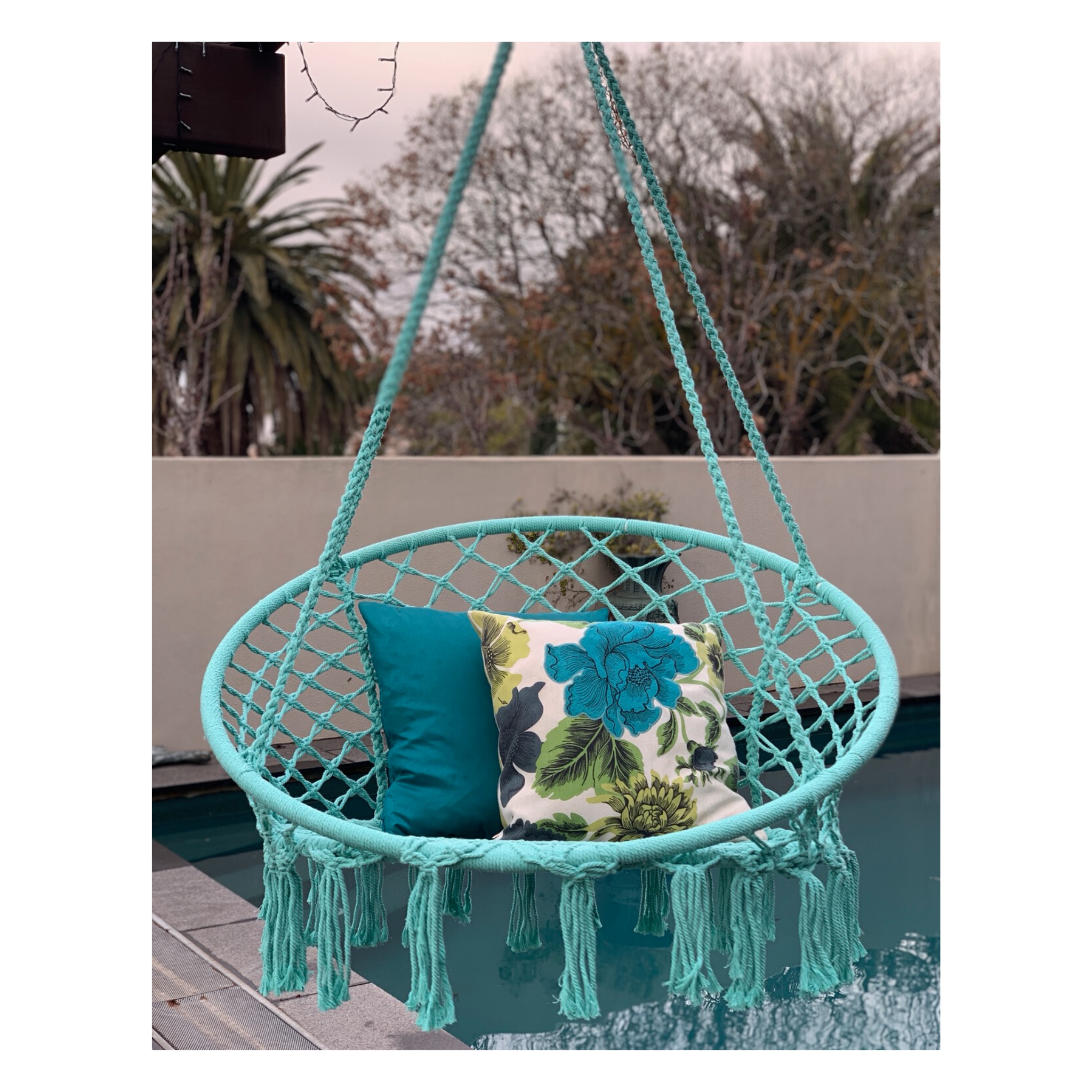 Macrame Hanging chair. Made from woven spearmint coloured cotton,