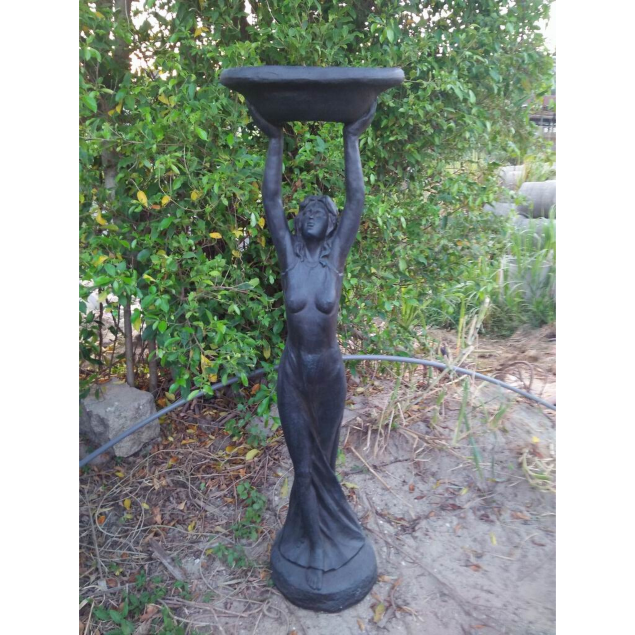 Statue - Lady Bird Feeder Bath - Dark Grey/Black in the garden