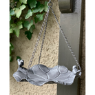 Hanging bird feeder with birds on the edge